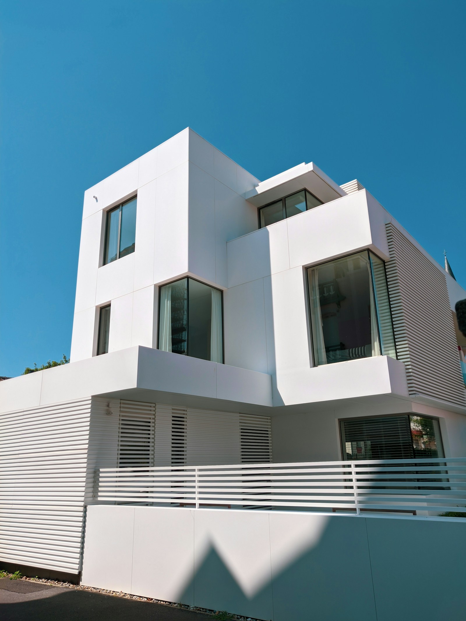 Modern white residential building under a blue sky in Argentina